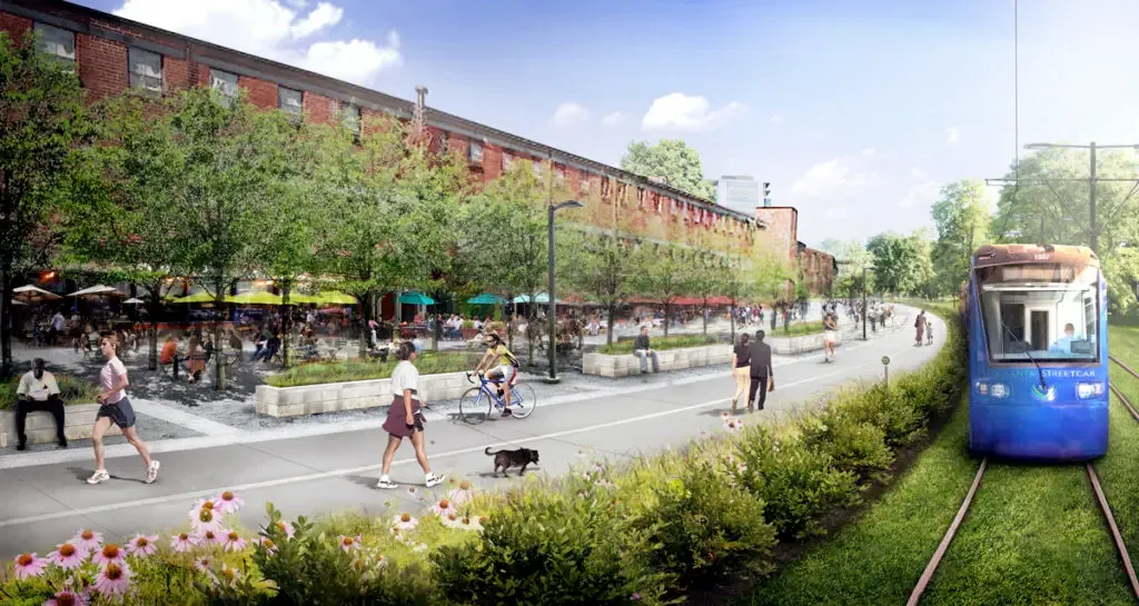 An artist's rendering of what the finished light rail project will look like on the BeltLine. Pedestrians walk along a footpath past restaurants with outdoor patio seating while a tram rolls past on grassy train tracks.