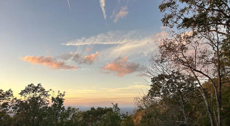 An autumn sunset from a mountaintop overlooking the trees in North Georgia.